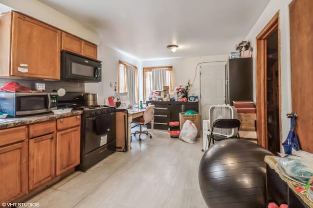 32 E 137th St, Riverdale, IL 60827 - kitchen with black appliances and brown cabinets