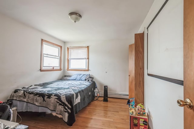 32 E 137th St, Riverdale, IL 60827 - bedroom with light wood-style flooring and baseboard heating