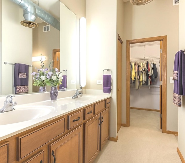 1716 Simms St Unit 0, Aurora, IL 60504 - bathroom with double vanity and a walk in closet