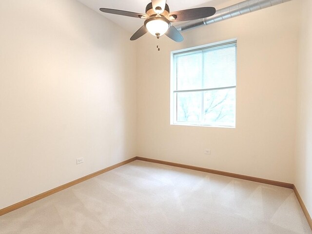 1716 Simms St Unit 0, Aurora, IL 60504 - empty room with light carpet and a ceiling fan