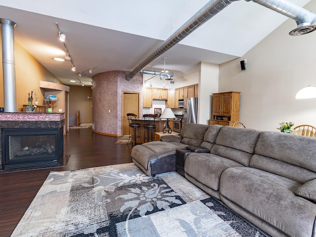 1716 Simms St Unit 0, Aurora, IL 60504 - living room featuring dark wood finished floors, track lighting, and a towering ceiling