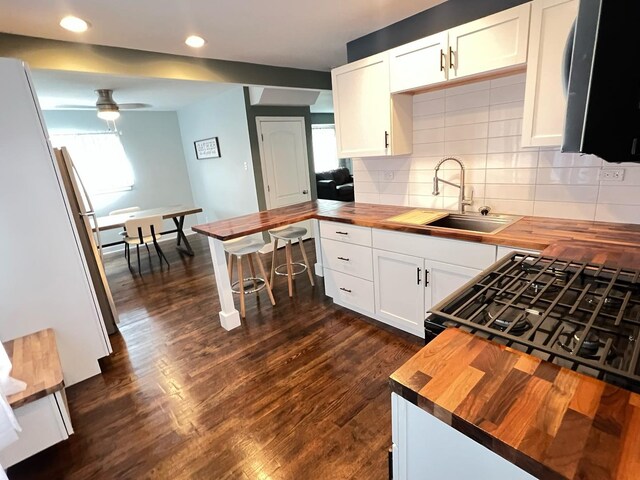 1474 Forest Ave, Calumet City, IL 60409 - kitchen featuring wooden counters, a sink, a ceiling fan, tasteful backsplash, and recessed lighting