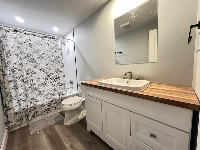 1474 Forest Ave, Calumet City, IL 60409 - full bathroom with toilet, wood finished floors, vanity, and shower / bath combo with shower curtain