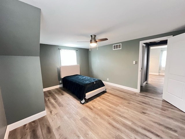 1474 Forest Ave, Calumet City, IL 60409 - bedroom featuring light wood finished floors, a ceiling fan, and baseboards