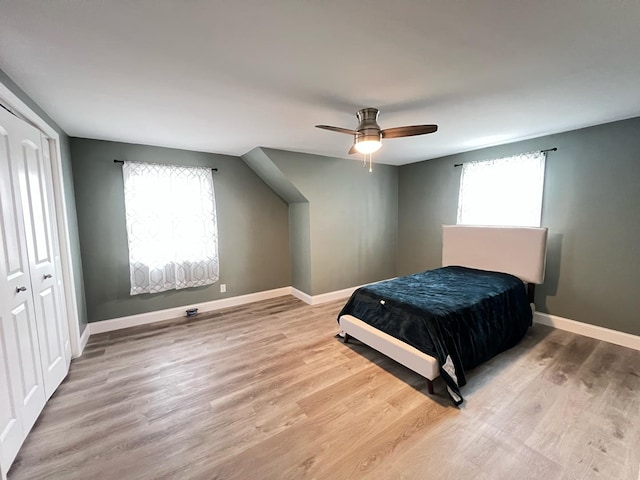 1474 Forest Ave, Calumet City, IL 60409 - bedroom featuring multiple windows, wood finished floors, and baseboards