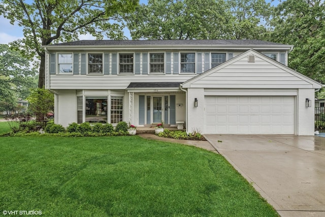 506 Westgate Rd, Deerfield, IL 60015 - view of front of home featuring an attached garage, a front yard, driveway, and brick siding