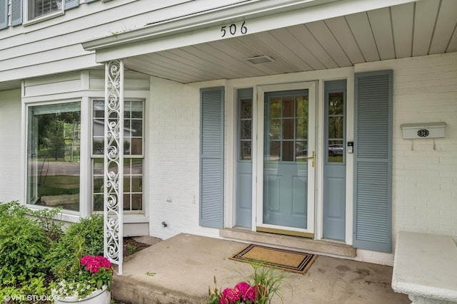 506 Westgate Rd, Deerfield, IL 60015 - view of exterior entry with covered porch and brick siding