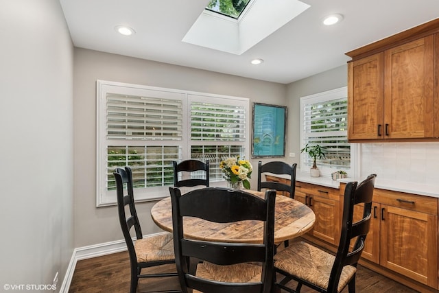 506 Westgate Rd, Deerfield, IL 60015 - dining space featuring a skylight, dark wood-type flooring, baseboards, and recessed lighting