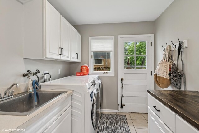506 Westgate Rd, Deerfield, IL 60015 - washroom with cabinet space, washer and dryer, light tile patterned floors, and baseboards