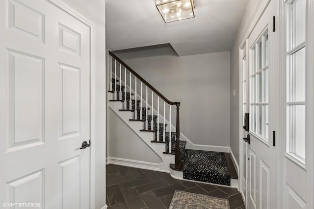 506 Westgate Rd, Deerfield, IL 60015 - entrance foyer featuring stairs, baseboards, and dark tile patterned flooring