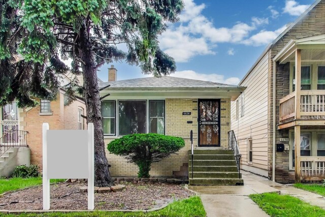 6636 S Rockwell St, Chicago, IL 60629 - view of front of property featuring brick siding and a chimney