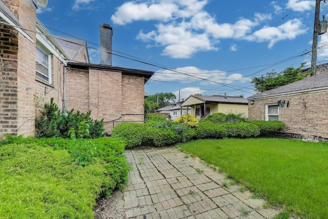6636 S Rockwell St, Chicago, IL 60629 - view of grassy yard featuring a patio area