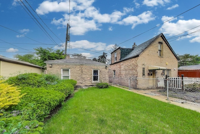 6636 S Rockwell St, Chicago, IL 60629 - rear view of house featuring brick siding and a shingled roof