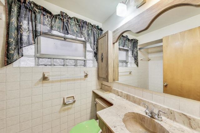 6636 S Rockwell St, Chicago, IL 60629 - bathroom featuring vanity, toilet, tile walls, tasteful backsplash, and a shower
