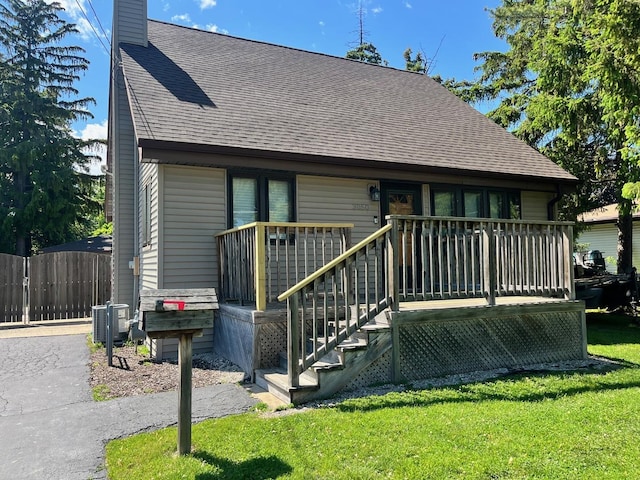 3050 Charles St, Melrose Park, IL 60164 - view of front of house featuring a shingled roof and a chimney