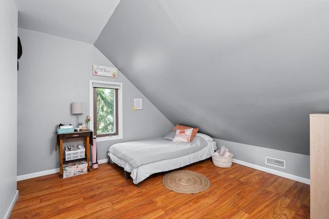 3050 Charles St, Melrose Park, IL 60164 - bedroom featuring lofted ceiling and wood finished floors