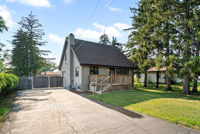 3050 Charles St, Melrose Park, IL 60164 - bungalow-style house with a gate, driveway, a chimney, a shingled roof, and covered porch