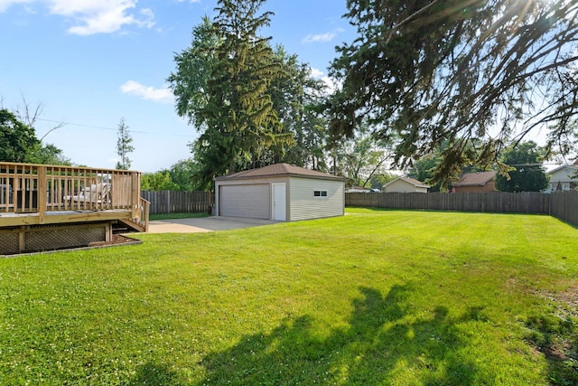 3050 Charles St, Melrose Park, IL 60164 - fenced backyard featuring a detached garage, an outbuilding, and a wooden deck