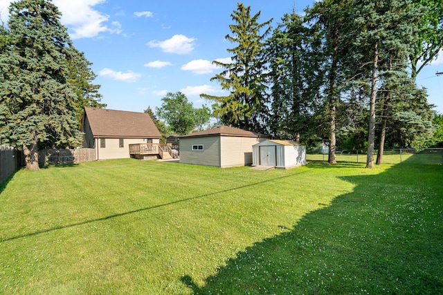 3050 Charles St, Melrose Park, IL 60164 - fenced backyard with a storage unit and a deck