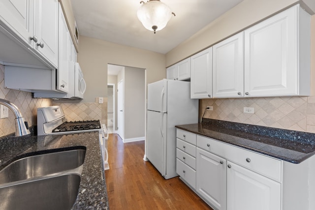 40 N Tower Rd Unit 14B, Oak Brook, IL 60523 - kitchen featuring a sink, white appliances, white cabinetry, wood finished floors, and baseboards