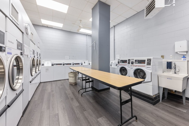 40 N Tower Rd Unit 14B, Oak Brook, IL 60523 - shared laundry room with independent washer and dryer, stacked washing machine and dryer, and wood finished floors