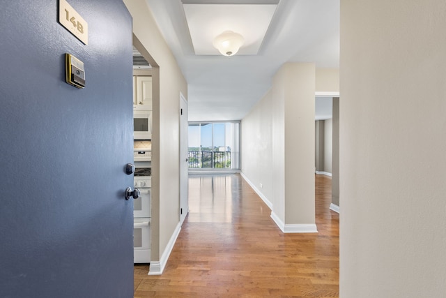 40 N Tower Rd Unit 14B, Oak Brook, IL 60523 - corridor featuring wood finished floors and baseboards