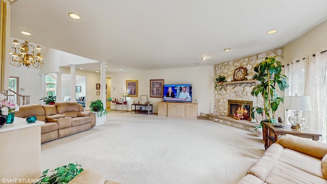 20195 Augusta Dr, Olympia Fields, IL 60461 - carpeted living area with ornate columns, recessed lighting, a stone fireplace, and a chandelier