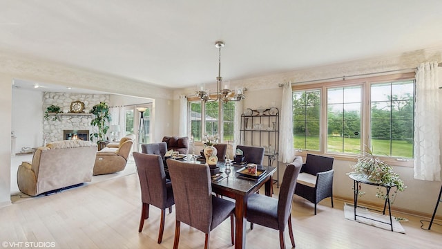 20195 Augusta Dr, Olympia Fields, IL 60461 - dining space featuring a chandelier, light wood-style floors, healthy amount of natural light, and baseboards