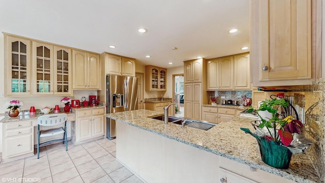20195 Augusta Dr, Olympia Fields, IL 60461 - kitchen featuring stainless steel fridge, a peninsula, a sink, light tile patterned floors, and glass insert cabinets