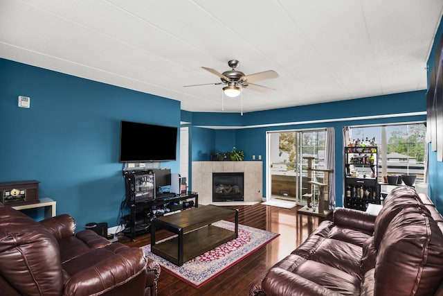 17212 Oak Park Ave Unit 2Sw, Tinley Park, IL 60477 - living room with a ceiling fan, hardwood / wood-style floors, a tiled fireplace, and baseboards