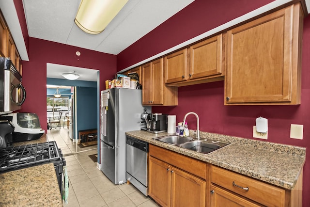 17212 Oak Park Ave Unit 2Sw, Tinley Park, IL 60477 - kitchen featuring appliances with stainless steel finishes, a sink, brown cabinets, and light tile patterned floors