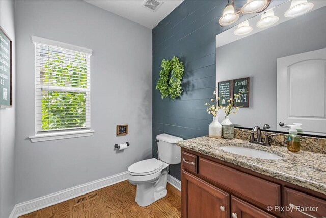 679 Slate Run, Elgin, IL 60124 - bathroom featuring wood finished floors, vanity, toilet, and baseboards