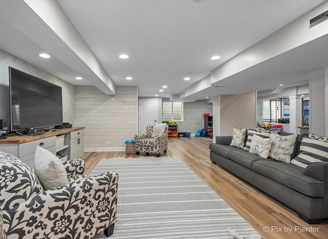 679 Slate Run, Elgin, IL 60124 - living area with light wood-type flooring, wood walls, and recessed lighting