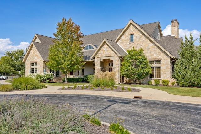 679 Slate Run, Elgin, IL 60124 - craftsman inspired home featuring stone siding, a chimney, and roof with shingles