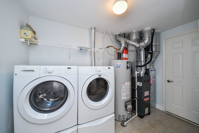 426 Victoria Ln Unit 426, Elgin, IL 60124 - laundry area with water heater, washer and dryer, heating unit, and tile patterned flooring