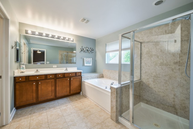 426 Victoria Ln Unit 426, Elgin, IL 60124 - full bathroom featuring double vanity, a stall shower, a bath, and tile patterned flooring