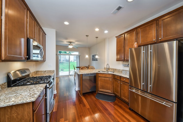 426 Victoria Ln Unit 426, Elgin, IL 60124 - kitchen featuring appliances with stainless steel finishes, a peninsula, a sink, dark wood-style floors, and a ceiling fan