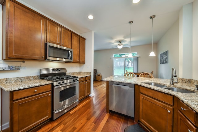 426 Victoria Ln Unit 426, Elgin, IL 60124 - kitchen with appliances with stainless steel finishes, a sink, dark wood-style flooring, a ceiling fan, and light stone countertops