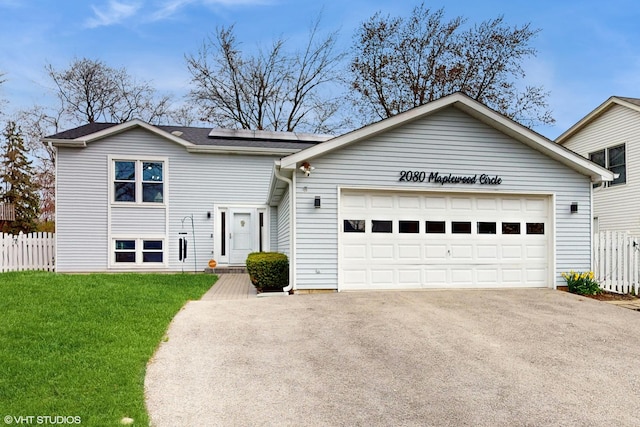 2080 Maplewood Cir, Naperville, IL 60563 - view of front of house featuring solar panels, an attached garage, and driveway