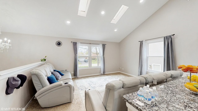 2080 Maplewood Cir, Naperville, IL 60563 - living room with lofted ceiling, a chandelier, a skylight, recessed lighting, and baseboards