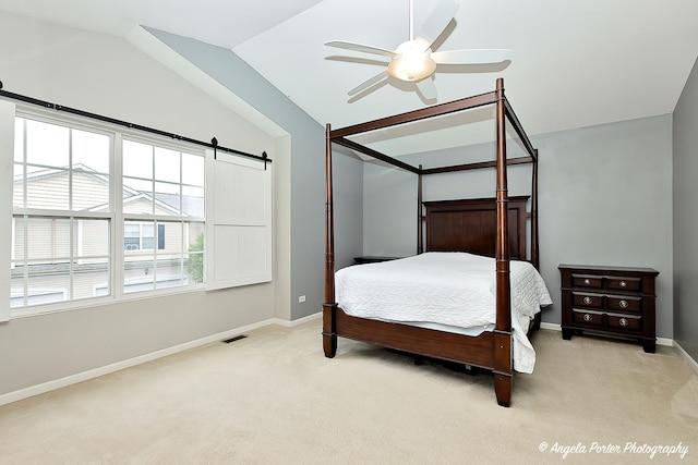 2704 Kendall Xing Unit 2704, Johnsburg, IL 60051 - bedroom featuring light colored carpet, lofted ceiling, baseboards, a ceiling fan, and a barn door
