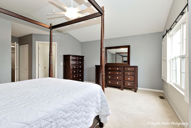 2704 Kendall Xing Unit 2704, Johnsburg, IL 60051 - bedroom with vaulted ceiling, light carpet, baseboards, ceiling fan, and a barn door