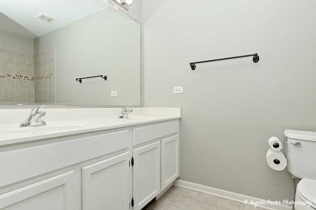 2704 Kendall Xing Unit 2704, Johnsburg, IL 60051 - bathroom with toilet, tile patterned flooring, double vanity, baseboards, and a shower