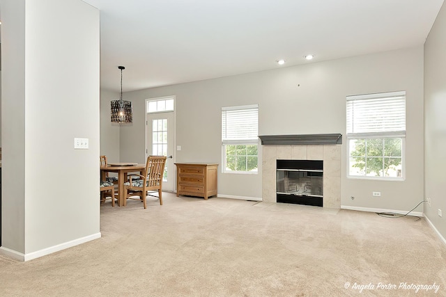 2704 Kendall Xing Unit 2704, Johnsburg, IL 60051 - living room featuring baseboards, light carpet, a fireplace, and recessed lighting