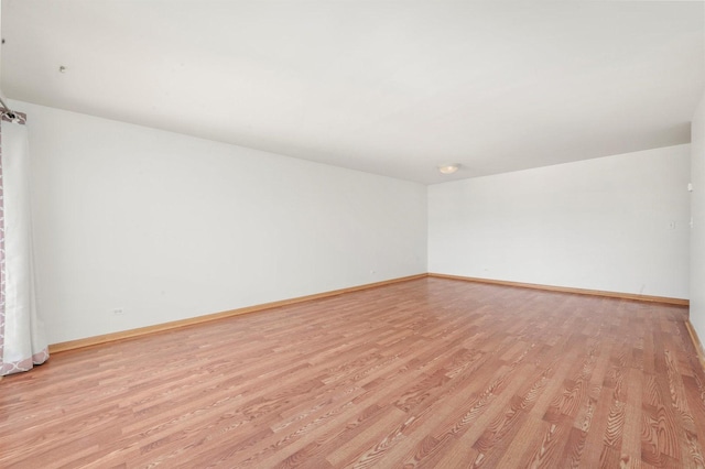 6534 N NW Hwy Unit 3D, Chicago, IL 60631 - spare room with light wood-style flooring and baseboards