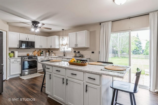 1987 Rosehill Ct, Romeoville, IL 60446 - kitchen with appliances with stainless steel finishes, a kitchen breakfast bar, healthy amount of natural light, and a sink