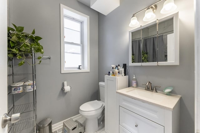 3340 W Polk St, Chicago, IL 60624 - full bathroom with toilet, vanity, baseboards, and a shower with shower curtain
