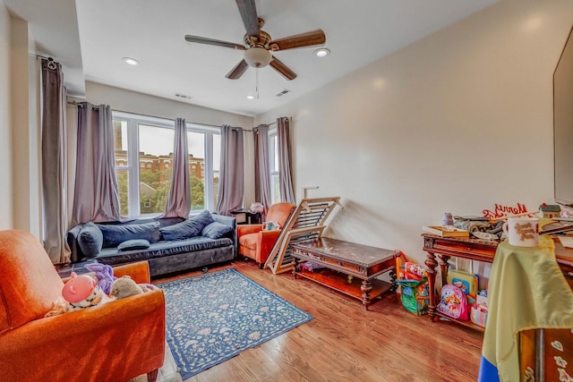 3340 W Polk St, Chicago, IL 60624 - living room with a ceiling fan, wood finished floors, and recessed lighting