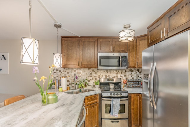 1221 N Dearborn St Unit 207N, Chicago, IL 60610 - kitchen with appliances with stainless steel finishes, a sink, brown cabinetry, and tasteful backsplash
