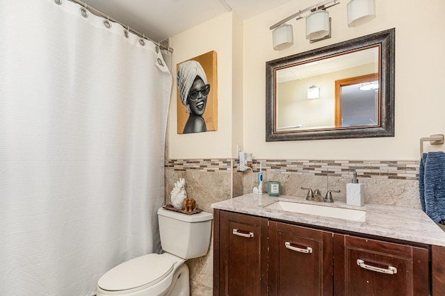 1221 N Dearborn St Unit 207N, Chicago, IL 60610 - full bathroom with toilet, vanity, tile walls, wainscoting, and tile patterned floors